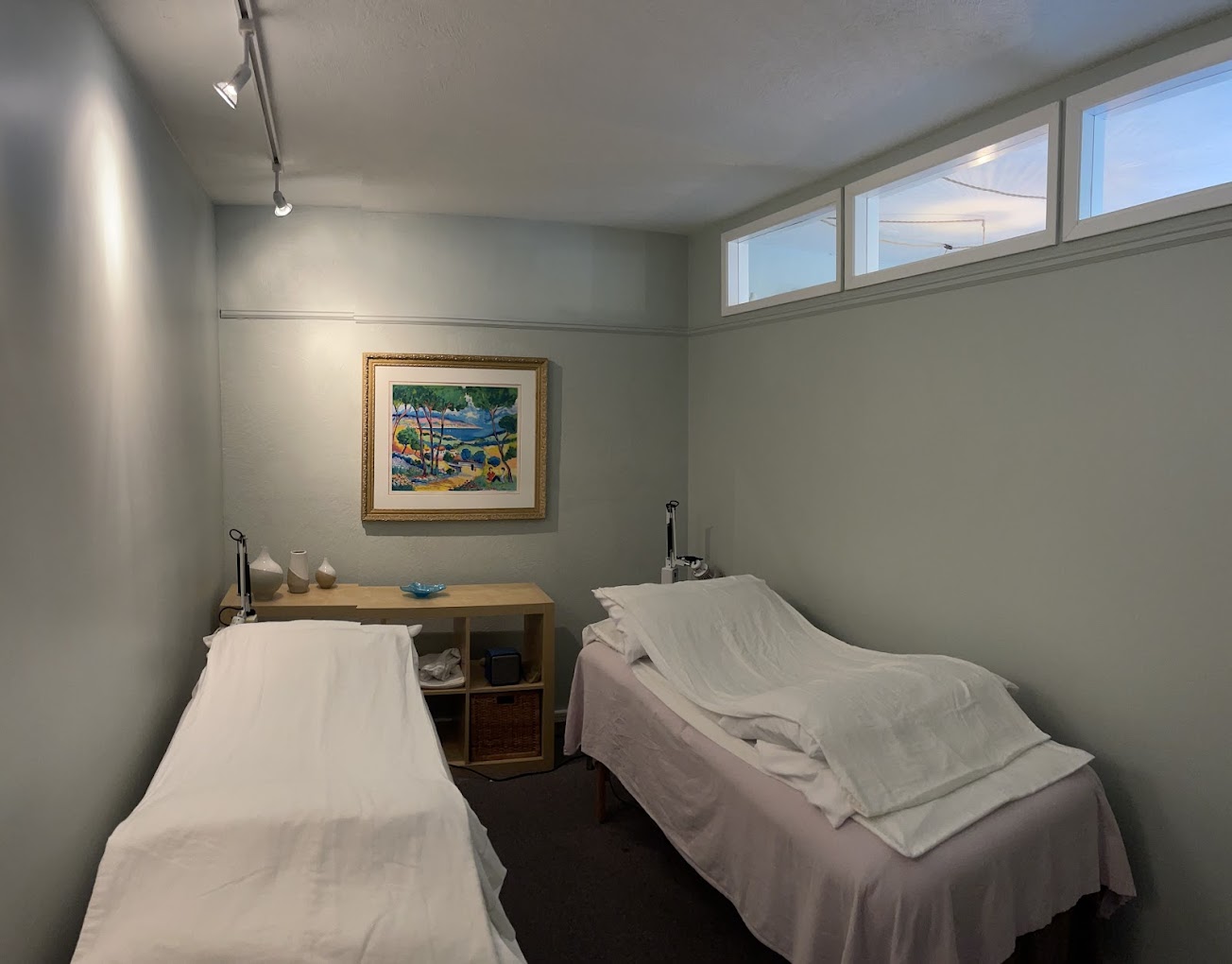 A quiet treatment room with a covered table